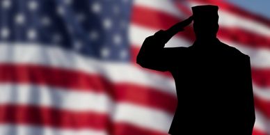 CDL Military Driver Programs shawdow man saluting Big american flag